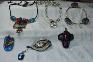 lot 300 image: Glass jewelry. Includes (2) necklaces, wire wrapped bracelet and (4) dichroic pendants.