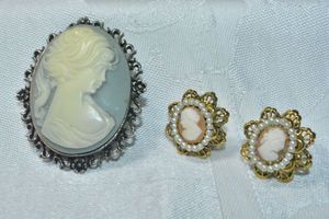 lot 296 image: Cameo jewelry. Includes signed Rene composite cameo convertible broochpin 2H (Marked Rene on back) and clip earrings 12W
