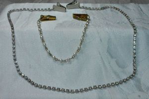 lot 309 image: Rhinestone sweater clip necklace and faux pearl sweater clip.