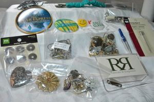 lot 316 image: Misc lot. Buttons, button covers, washer words, scarf clip, Snag Nab-it, tools, single earrings, pin backs including Polar Express plus
