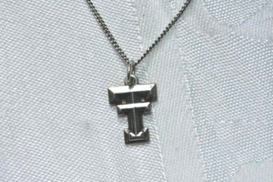 lot 328 image: Sterling Silver James Avery Texas Tech pendant on sterling cable chain 18L necklace. Marked 925 with James Avery logo and 925 on lobster clasp.