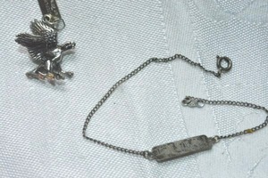 lot 340 image: Sterling Silver eagle pendant by Bell. Has Bell 925 hang tag. 1L. Includes ACO brand name bracelet. Inscribed MKB. Marked ACO Stg on plate and ACO Sterling on clasp. 7L