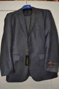 lot 95 image: 2-piece suit by Vitali Super 120s. Size S3630W model 2B-NP, Charcoal color. Looks New Never Worn, pants havent been tailored.