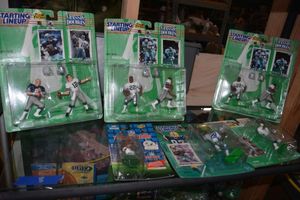 lot 8 image: Football Player figurines still in packages Starting Lineup and NFL Headliners brands.  Dallas Cowboys.