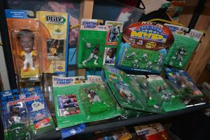 lot 9 image: Basketball and Football Player figurines still in packages Play Makers, Starting Lineup and NFL Headliners brands. Kobe Bryant and Dallas Cowboys.