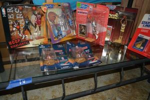 lot 10 image: Basketball Player figurines still in packages Starting Lineup and NBA Headliners brands. Dennis Rodman, Kareem, Grant Hill.
