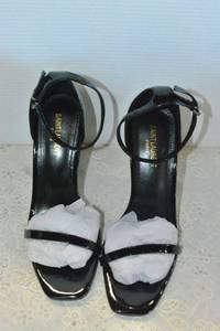 lot 71 image: Saint Laurent Black Patent Shoe with black YSL heel, Marked Saint Laurent Paris made in Italy size 38