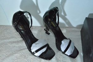 lot 75 image: Saint Laurent Black Patent Shoe with black YSL heel, Marked Saint Laurent Paris made in Italy size 39