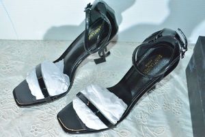lot 77 image: Saint Laurent Black Patent Shoe with black YSL heel, Marked Saint Laurent Paris made in Italy size 39