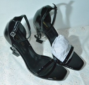lot 83 image: Saint Laurent Black Patent Shoe with black YSL heel, Marked Saint Laurent Paris made in Italy size 38