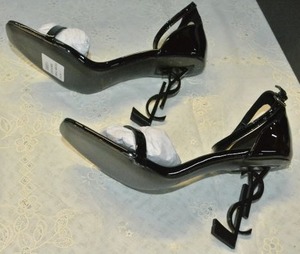 lot 84 image: Saint Laurent Black Patent Shoe with black YSL heel, Marked Saint Laurent Paris made in Italy size 38