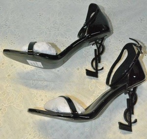 lot 85 image: Saint Laurent Black Patent Shoe with black YSL heel, Marked Saint Laurent Paris made in Italy size 39