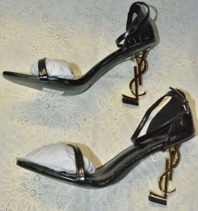 lot 87 image: Saint Laurent MATTE Crocodile Black Sandal with GOLD YSL heel, Marked Saint Laurent Paris made in Italy size 40