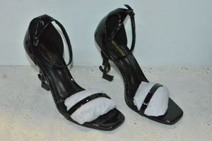 lot 88 image: Saint Laurent Black Patent Shoe with black YSL heel, Marked Saint Laurent Paris made in Italy size 39