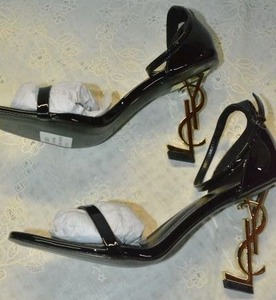 lot 89 image: Saint Laurent Black Patent Shoe with GOLD YSL heel, Marked Saint Laurent Paris made in Italy size 39