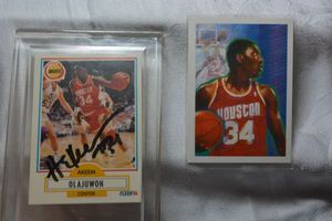 lot 12 image: Akeem Olajuwon signed and unsigned Trading cards