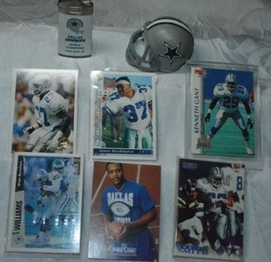 lot 24 image: Dallas Cowboys Trading cards, Lighter and mini helmet. Emmitt Smith, Kenneth Gant, Kevin Williams, Deion Sanders and more