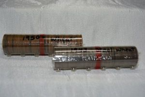 lot 45 image: Roll of 1950s wheat pennies and Roll and 1943 Steel pennies