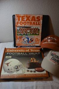 lot 119 image: Univ. of Texas Football Vault book, National Champs ballcaps, and signed Football program from 1998 by Wane McGarity