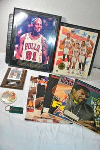 lot 146 image: Dennis Rodman Plaque, magazines, puzzle, Magic Johnson plaquecard, button and Atlanta 1996 keychain