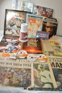 lot 153 image: Ricky Williams signed cup, Texas Longhorns book, magazines and newspapers. Plus buttons.