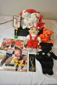 lot 109 image: Carl Lewis magazine and trading card, Plush toys, Ricky Williams Saints and Muhammad Ali Beannie Babies. Plus Barcelona keychain