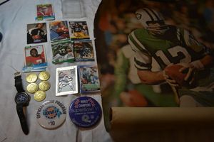 lot 111 image: Joe Nammoth poster, Super Bowl buttons, Collector coins, trading cards