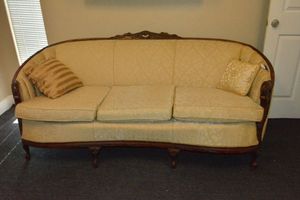 lot 190 image: Duncan Phyfe Style Couch with 3 Cushions. Features Cream colored Upholstery and carved wood trim.
