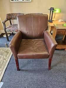 lot 178 image: Brown upholstered armchair