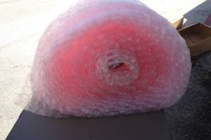 lot 22 image: Big Roll Of 24-Wide Pink Bubble Wrap, Length Unknown