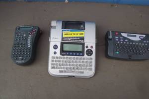lot 31 image: 3-Label Makers, 1-Dymo Labelpoint 100, 1-Brothers-P Touch And 1- Esselte, No Tape for any maching is  included