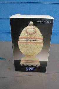 lot 122 image: ROYAL LIMITED-Musical Wedding Egg With Rotating Doves Inside, Wind-up Plays Laras Theme, In Box,  Works