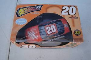 lot 10 image: NASCAR- # 20 Tony Stewart  Joe Gibbs Radio Control Car, About 6-Long-In Box.