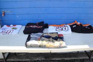 lot 13 image: Basket Of Nascar #20 Tony Stewart Shirts And Throw Blanket-See Photos