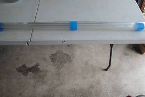lot 74 image: 11- 4-Ft. Heavy Clear Glass Tubes, About 516 I.D. And 12 O.D.