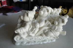 lot 140 image: St. Nicholas Square Porcelain Collectable Bears On A Sled With Windup Music Box Figurine