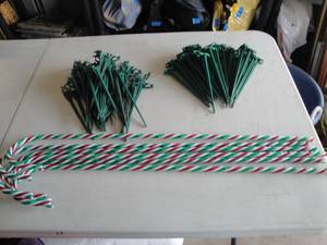 lot 163 image: Lot-Of About 90-8 Long Christmas Light Yard Stakes And 6-30 Red White And Green Candy Canes