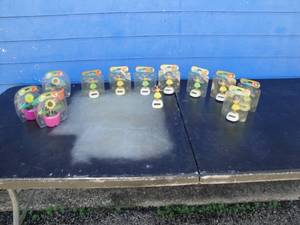 lot 225 image: Lot Of 12-Solar Toys, 9-Hula Girls And 3-Flower Pots