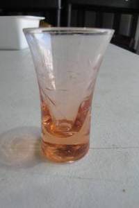 lot 256 image: Vintage PINK Glass Whiskey Shot Glass With Etched Vine Design And Measuring Dots