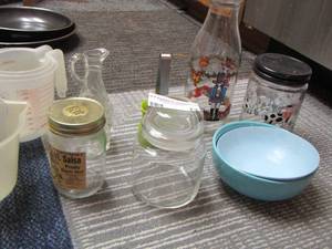 lot 73 image: Plastic measuring cups, milk jar, vinegar oil canister-dispenser