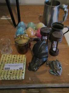 lot 46 image: Coasters- candle eggs- frog- metal cup- plus