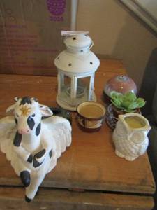 lot 48 image: Cow with wings- wax plant candle holders plus