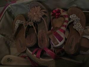 lot 93 image: Pink heart suitcase full of womens sandals size 8