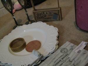 lot 95 image: Solid marble cheese board with wine cutters, white plastic platters qty 4- 2 silver wine glasses