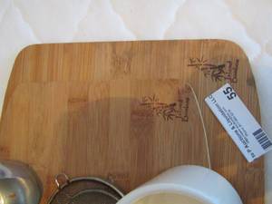 lot 55 image: 2 island bamboo cutting boards, coffee cup, hand strainer, ladle