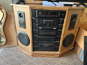 lot 2 image: SOUNDESIGN STEREO SYSTEM -AMFM, CD PLAYER, CASSETTE, COMPACT DISC STORAGE, CD  IN CABINET W SPEAKER