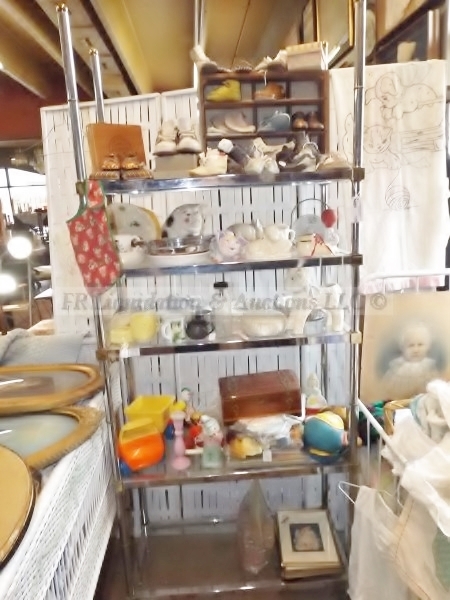 lot 105 image: Display shelf and baby item contents