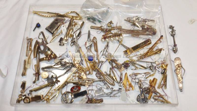lot 812 image: Assorted tie clips, sterling and intaglio pins
