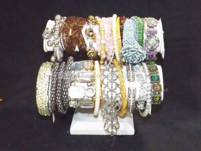 lot 539 image: Bracelet assortment on bracelet arm display