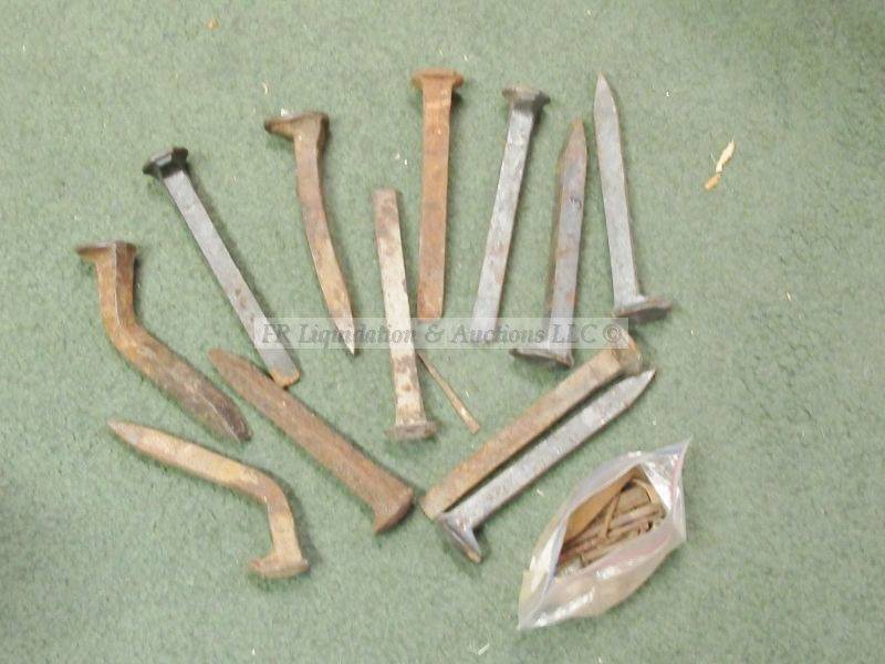 lot 729 image: Classic railroad spikes and nails